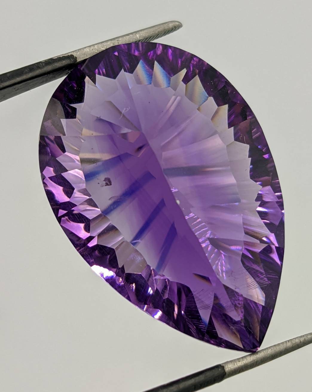 ARSAA GEMS AND MINERALSTop quality Rwandan Amethyst gem. Concave cut and in pear shape. Excellent color with Eye clean clarity, weight: 50 carats - Premium from ARSAA GEMS AND MINERALS - Just $150.00! Shop now at ARSAA GEMS AND MINERALS