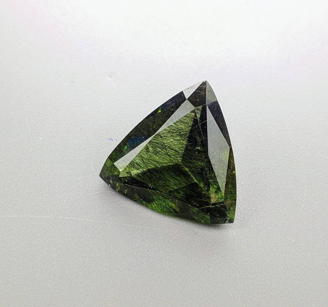 Rutile peridot Gem Peridot containing hairlike inclusions Ludwigite from Mansehra KP Pakistan, 13.5 carats