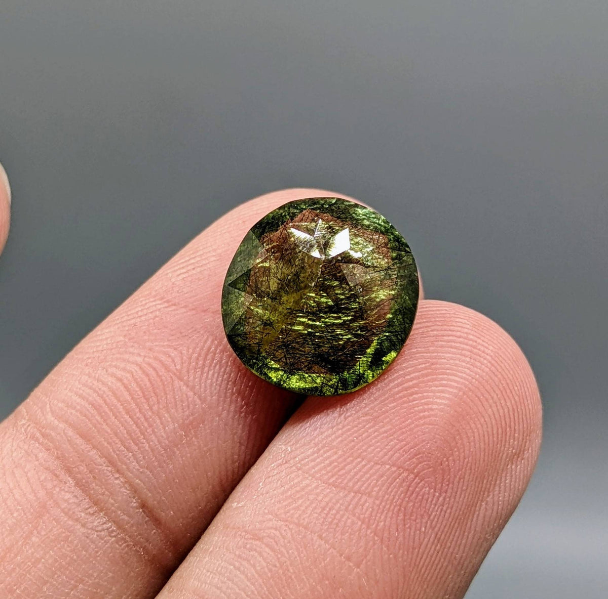 Rutile peridot Gem Peridot containing hairlike inclusions Ludwigite from Mansehra KP Pakistan, 7.5 carats