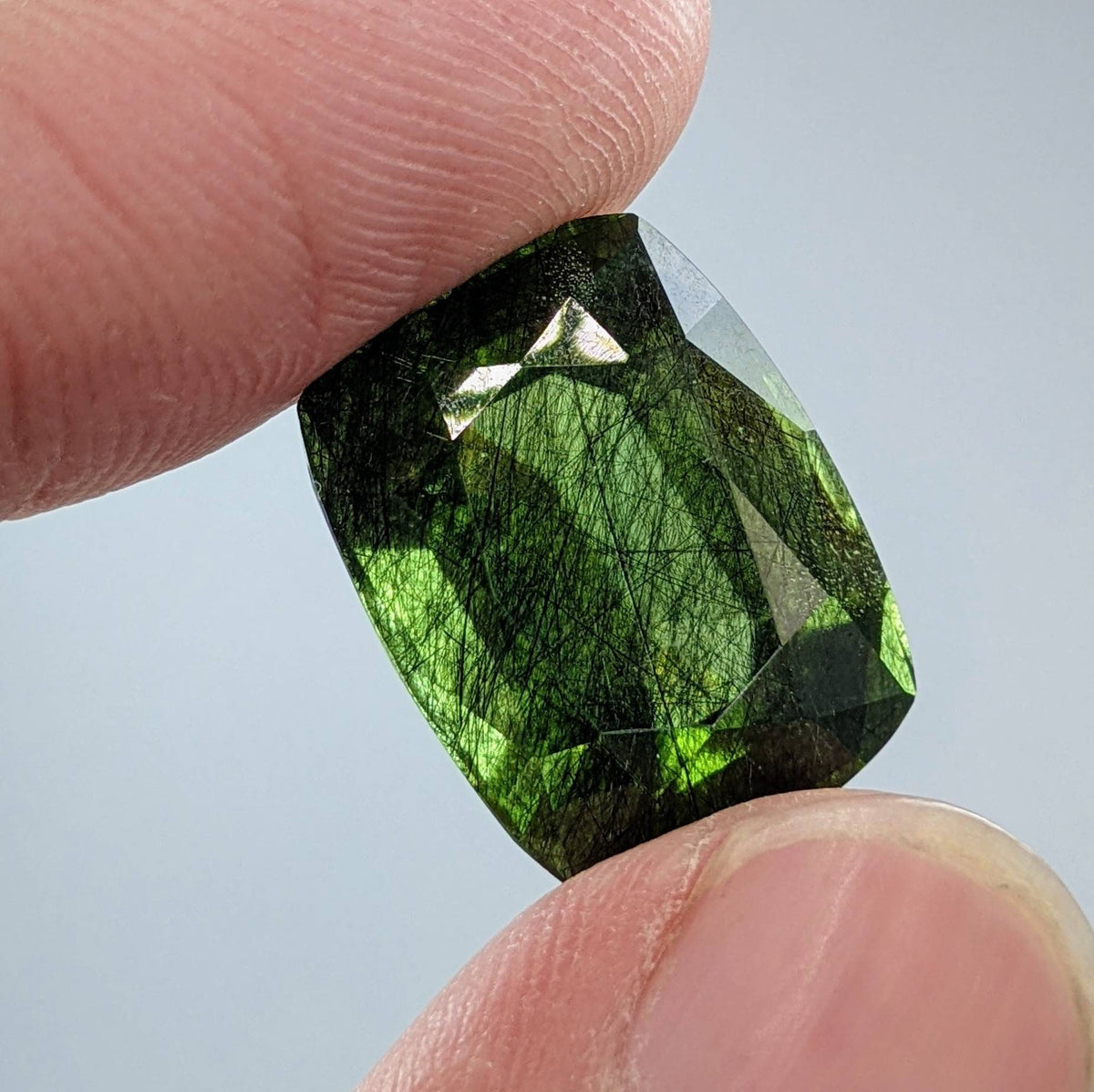 Rutile peridot Gem Peridot containing hairlike inclusions Ludwigite from Mansehra KP Pakistan, 20 carats