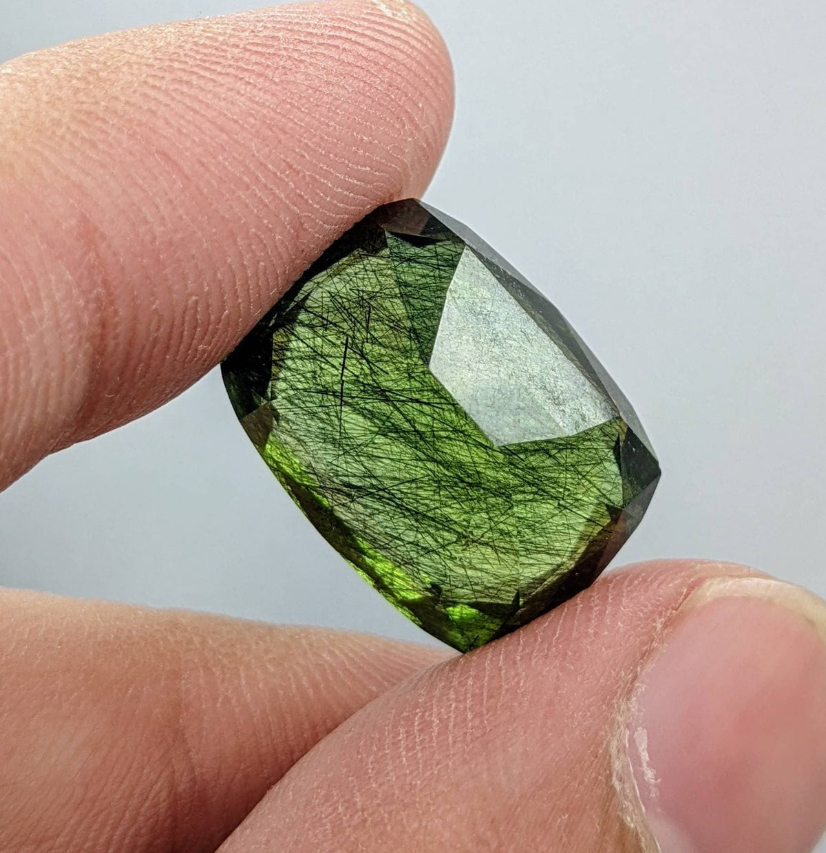 Rutile peridot Gem Peridot containing hairlike inclusions Ludwigite from Mansehra KP Pakistan, 20 carats