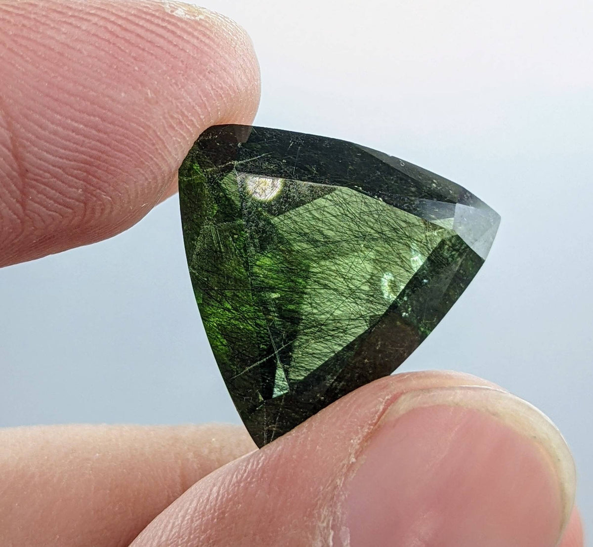 Rutile peridot Gem Peridot containing hairlike inclusions Ludwigite from Mansehra KP Pakistan, 13.5 carats