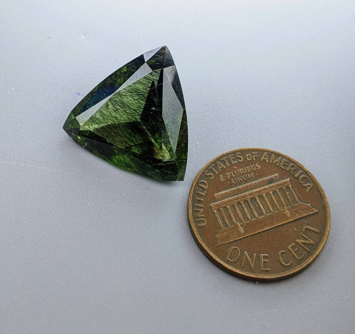 Rutile peridot Gem Peridot containing hairlike inclusions Ludwigite from Mansehra KP Pakistan, 13.5 carats