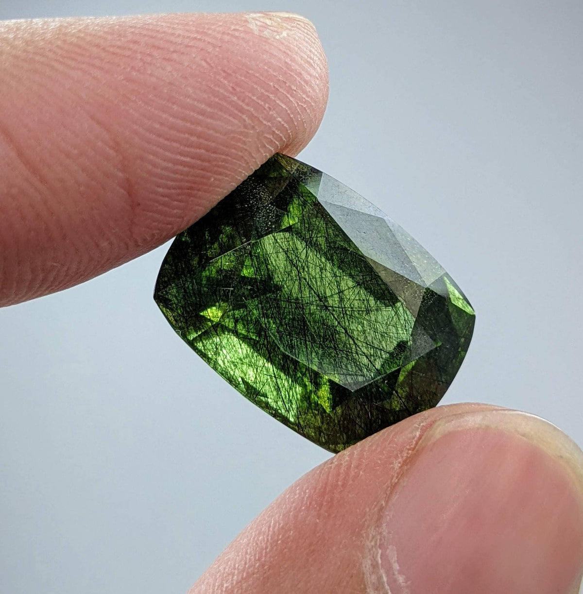 Rutile peridot Gem Peridot containing hairlike inclusions Ludwigite from Mansehra KP Pakistan, 20 carats