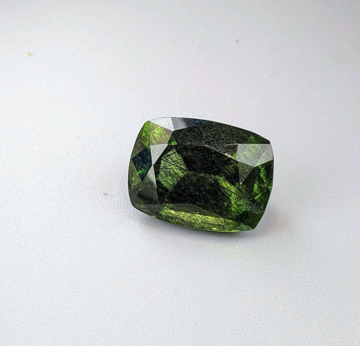 Rutile peridot Gem Peridot containing hairlike inclusions Ludwigite from Mansehra KP Pakistan, 20 carats