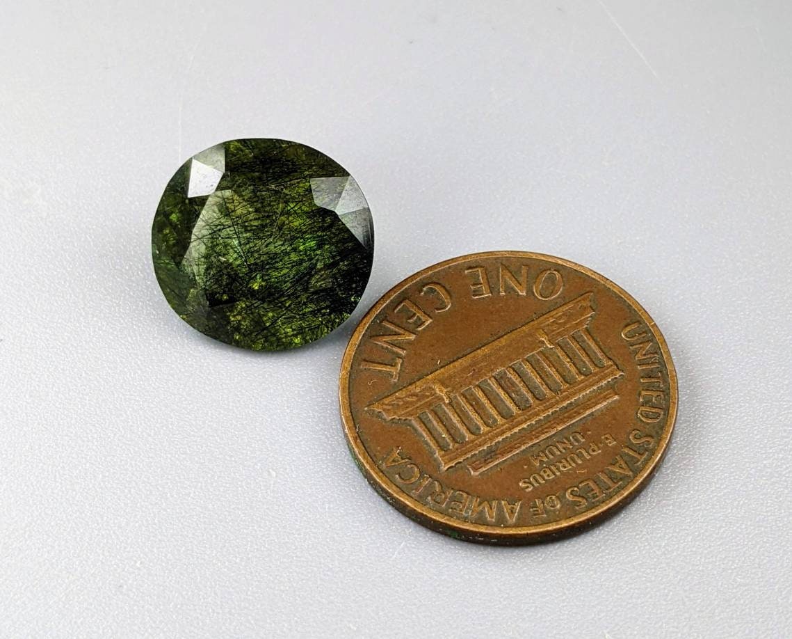 Rutile peridot Gem Peridot containing hairlike inclusions Ludwigite from Mansehra KP Pakistan, 7.5 carats