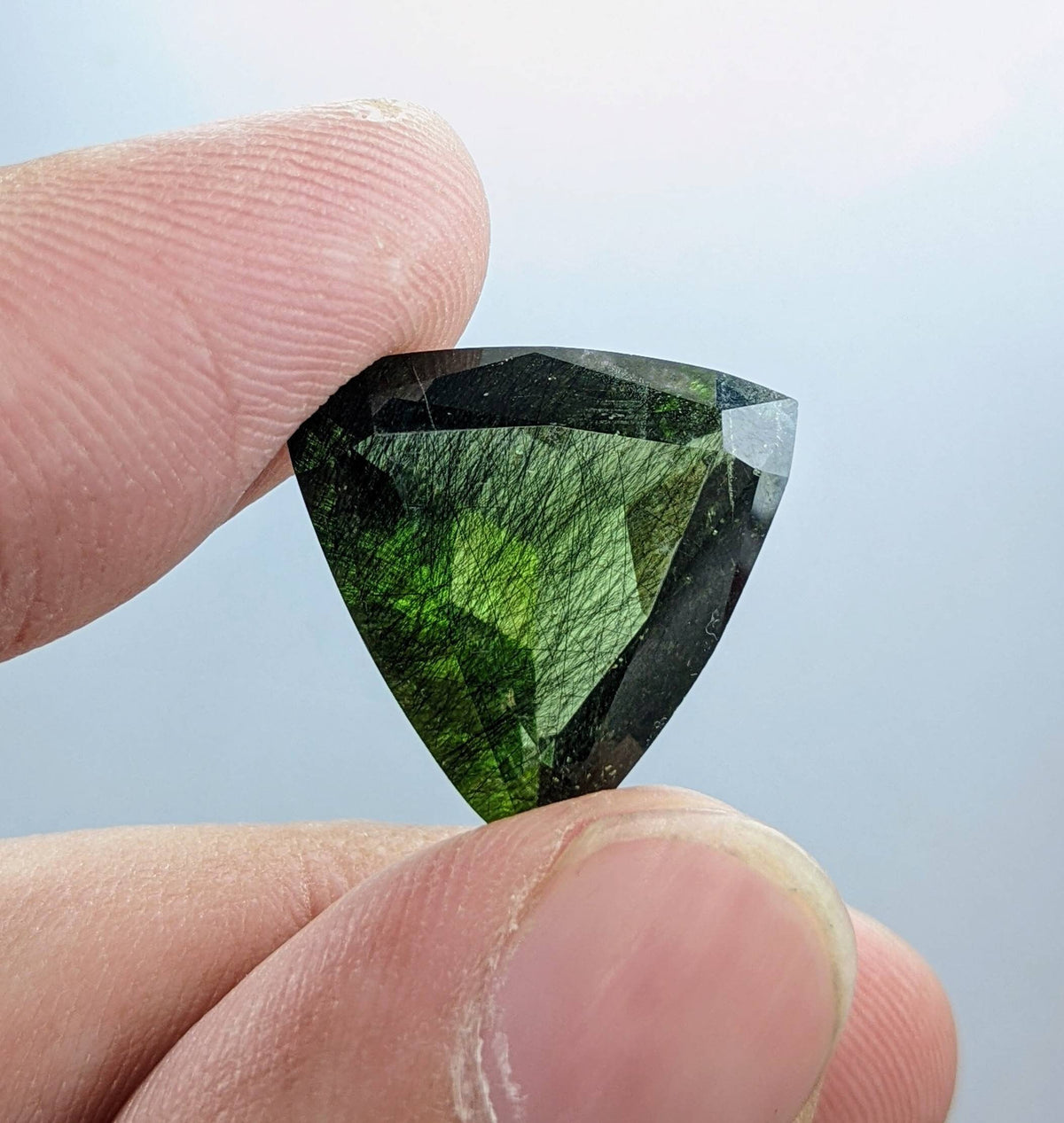 Rutile peridot Gem Peridot containing hairlike inclusions Ludwigite from Mansehra KP Pakistan, 13.5 carats