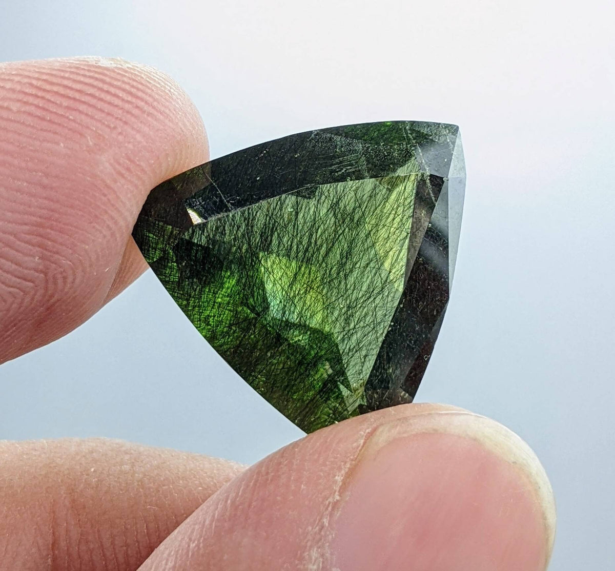 Rutile peridot Gem Peridot containing hairlike inclusions Ludwigite from Mansehra KP Pakistan, 13.5 carats