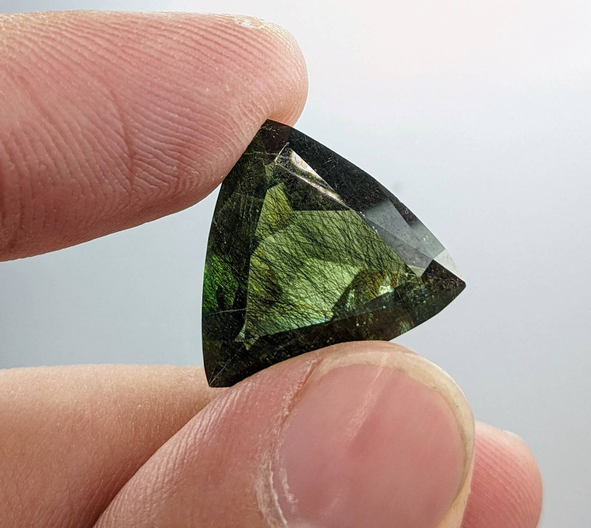 Rutile peridot Gem Peridot containing hairlike inclusions Ludwigite from Mansehra KP Pakistan, 13.5 carats
