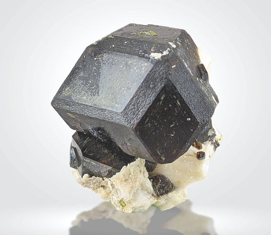 On matrix andradite garnet crystal from Pakistan, 37.3 grams