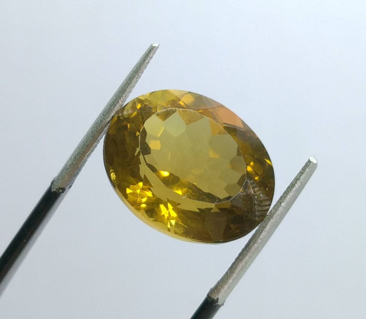 10.5 Carat Oval Faceted Citrine Gem, VV Clarity