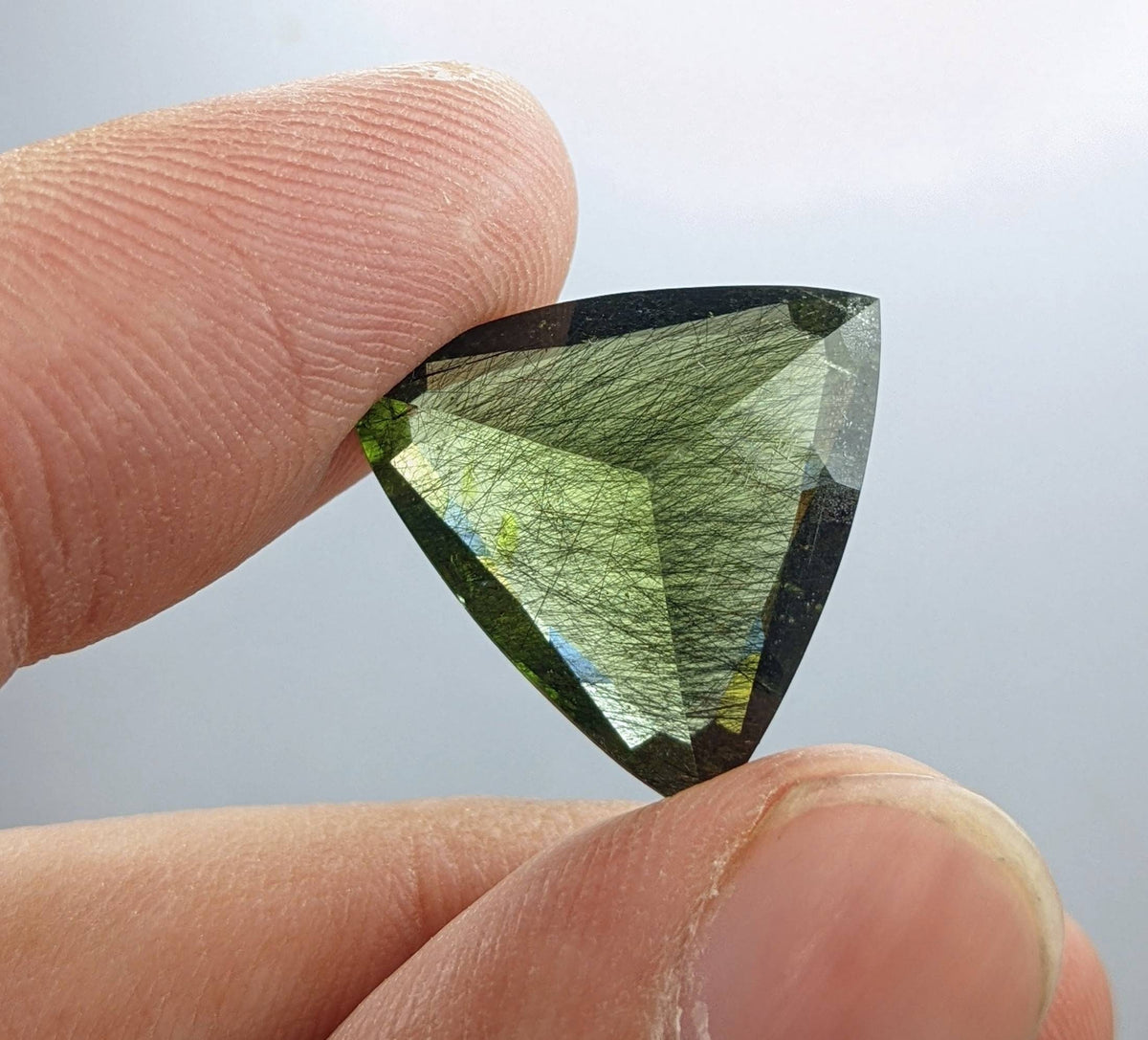 Rutile peridot Gem Peridot containing hairlike inclusions Ludwigite from Mansehra KP Pakistan, 13.5 carats