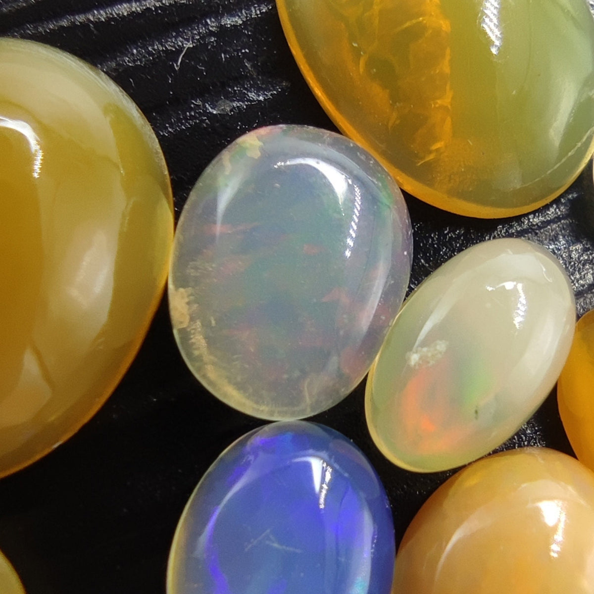 Natural small lot small sizes oval shapes fire opal Cabochons, 31 pieces, 10 carats