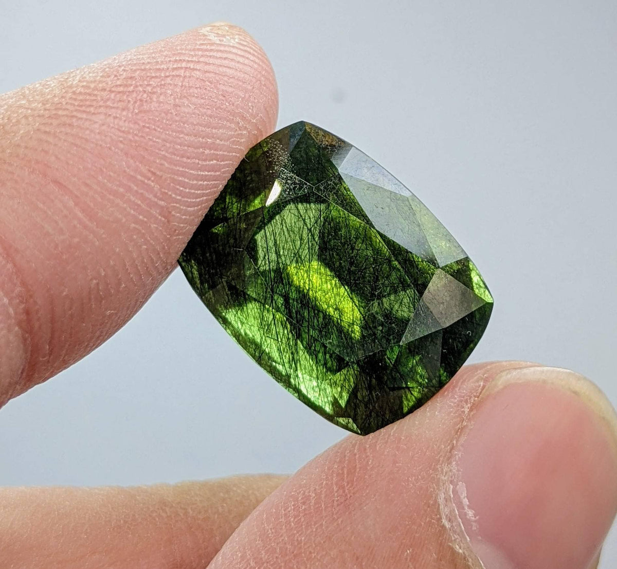 Rutile peridot Gem Peridot containing hairlike inclusions Ludwigite from Mansehra KP Pakistan, 20 carats
