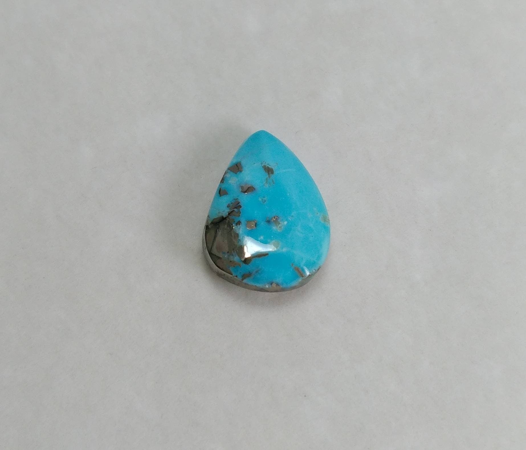 ARSAA GEMS AND MINERALSNatural aesthetic pear shape 7.5 carats faceted turquoise with pyrite cabochon - Premium  from ARSAA GEMS AND MINERALS - Just $24.00! Shop now at ARSAA GEMS AND MINERALS