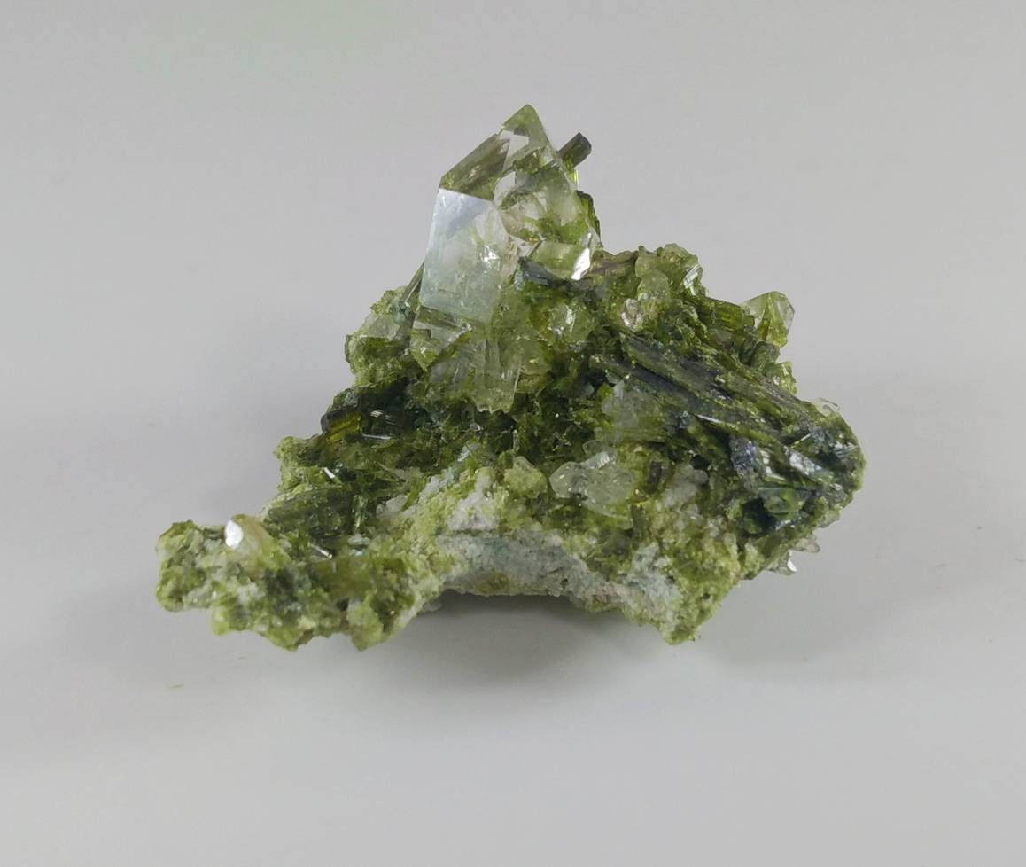 ARSAA GEMS AND MINERALSGreen epidote inclusion in transparent quartz crystal from Pakistan, weight: 9.4 grams - Premium  from ARSAA GEMS AND MINERALS - Just $30.00! Shop now at ARSAA GEMS AND MINERALS