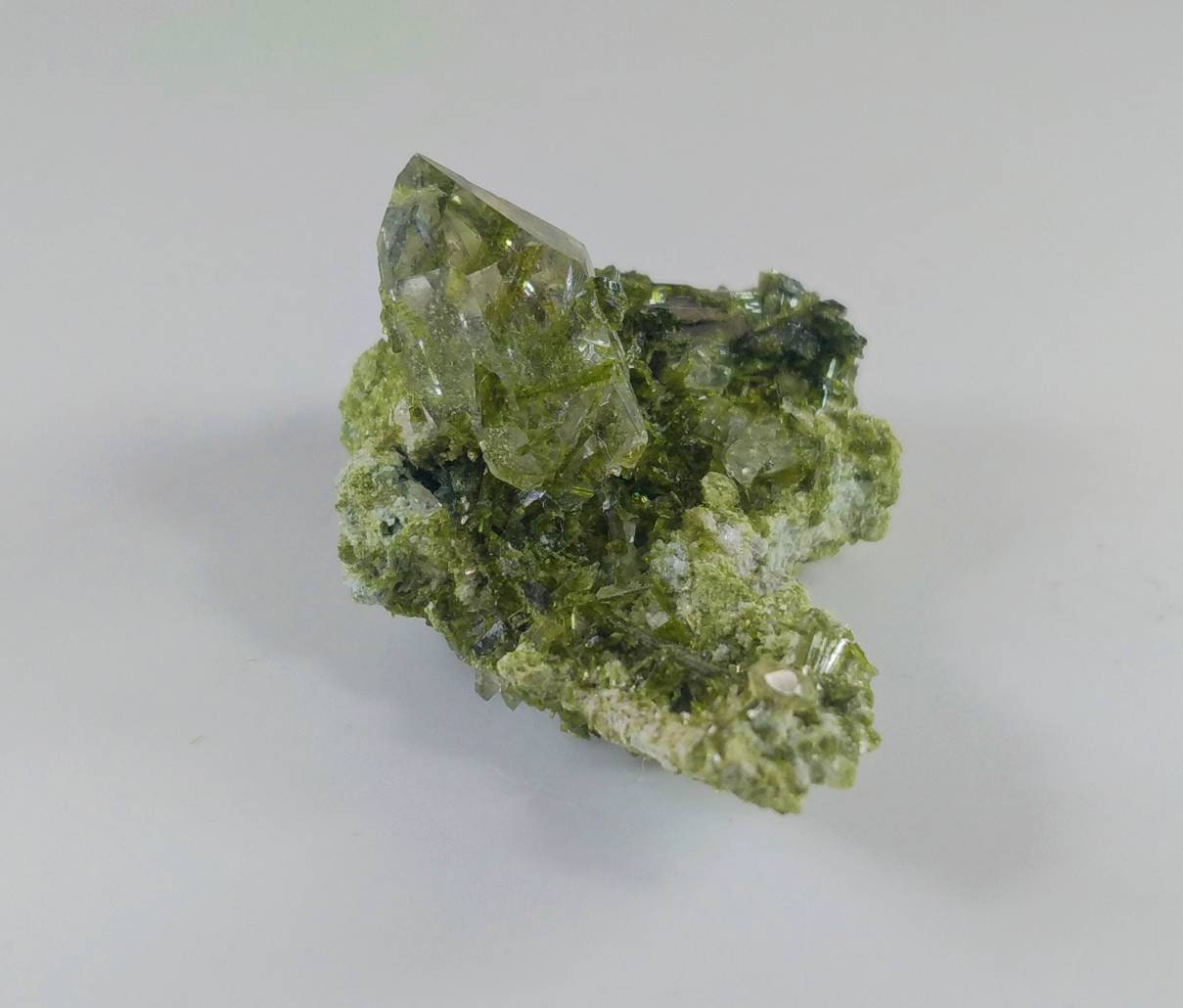 ARSAA GEMS AND MINERALSGreen epidote inclusion in transparent quartz crystal from Pakistan, weight: 9.4 grams - Premium  from ARSAA GEMS AND MINERALS - Just $30.00! Shop now at ARSAA GEMS AND MINERALS