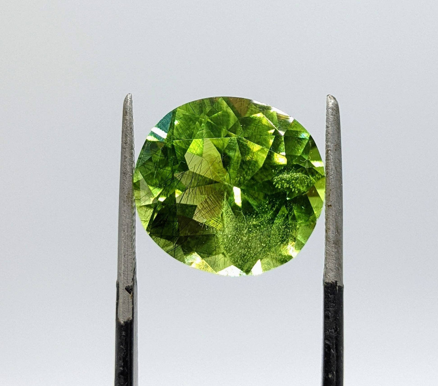 ARSAA GEMS AND MINERALSRutile peridot Gem Peridot containing hairlike inclusions Ludwigite from Mansehra KP Pakistan, 11.5 carats - Premium  from ARSAA GEMS AND MINERALS - Just $200.00! Shop now at ARSAA GEMS AND MINERALS