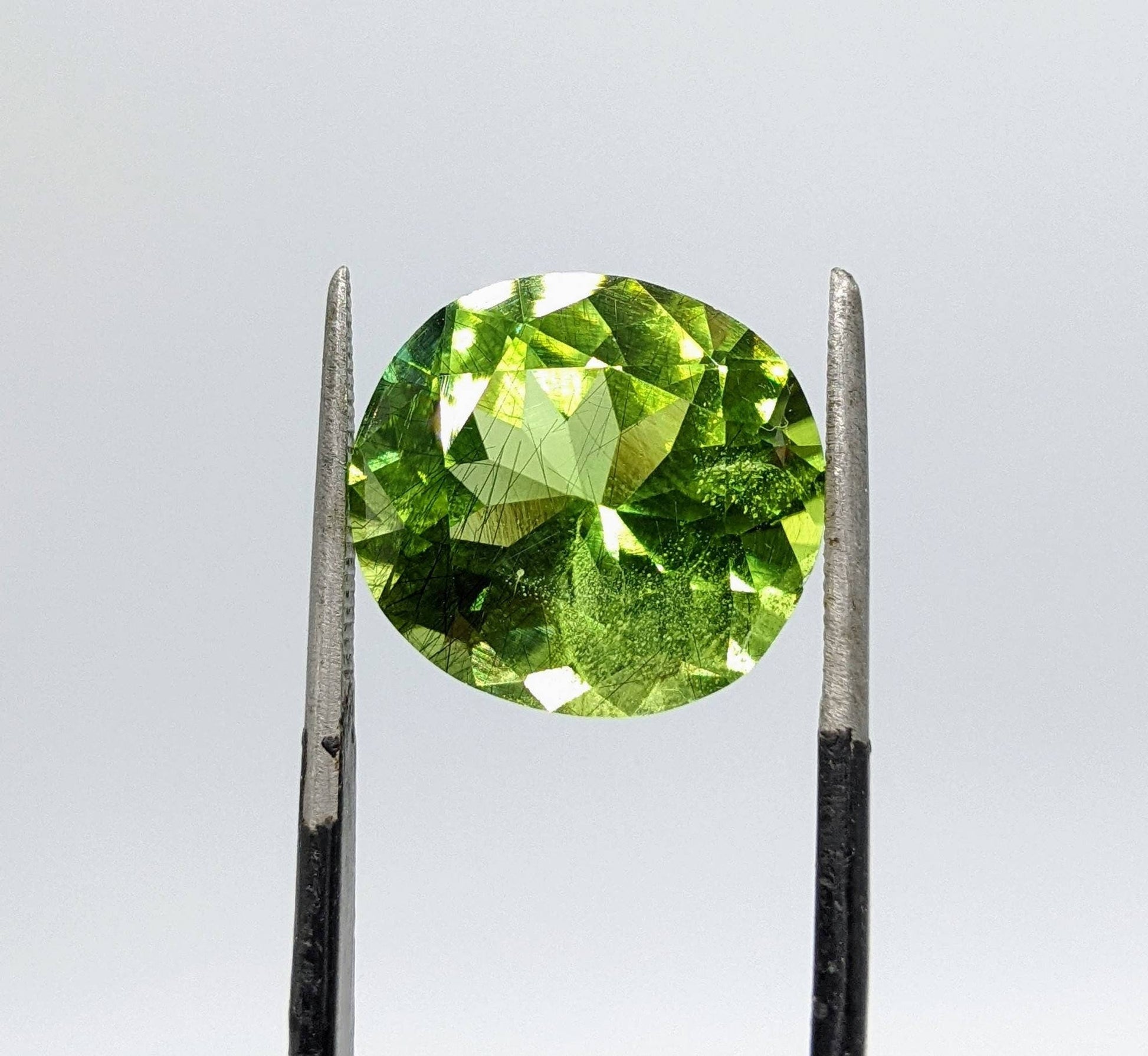 ARSAA GEMS AND MINERALSRutile peridot Gem Peridot containing hairlike inclusions Ludwigite from Mansehra KP Pakistan, 11.5 carats - Premium  from ARSAA GEMS AND MINERALS - Just $200.00! Shop now at ARSAA GEMS AND MINERALS
