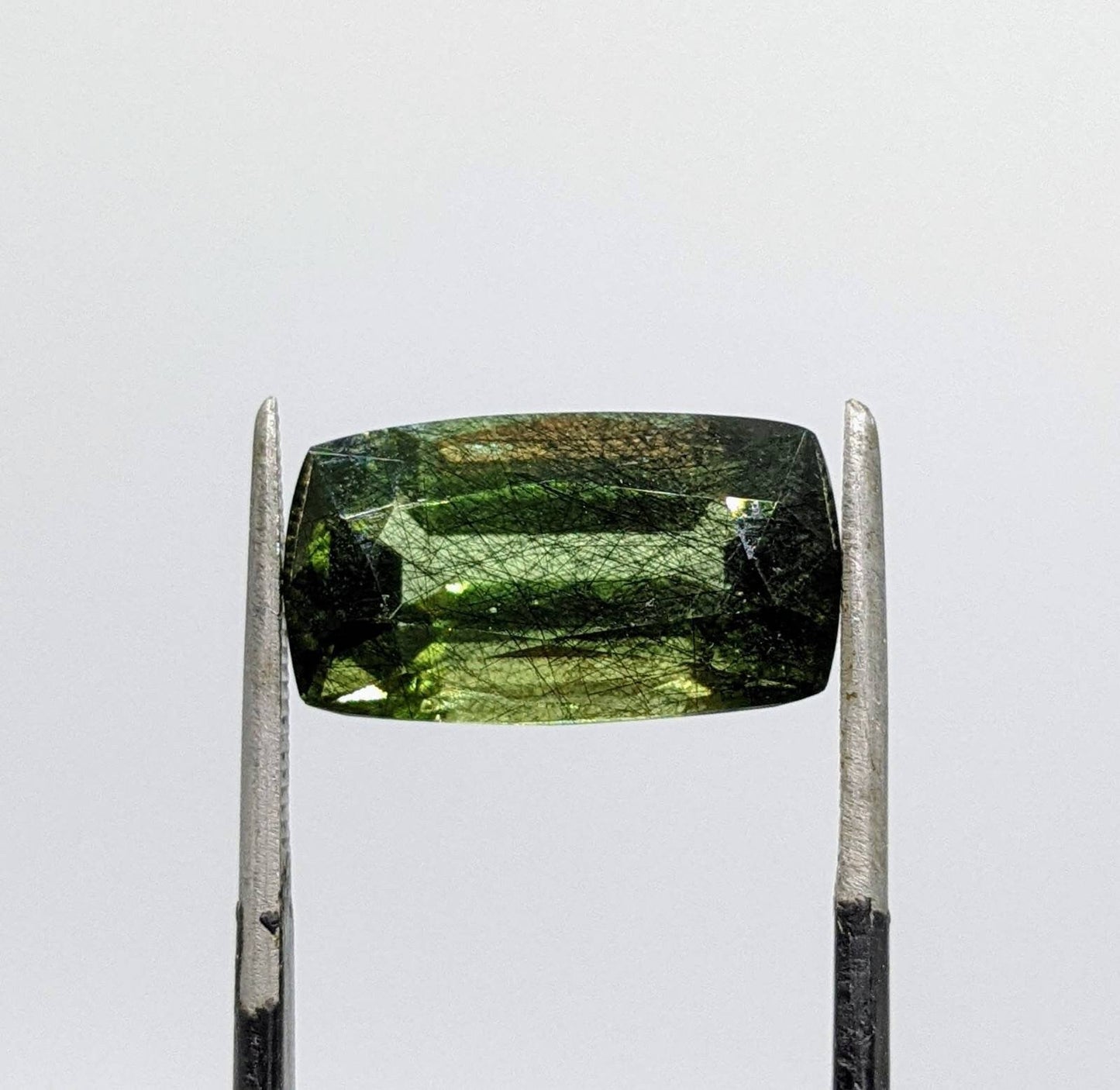 ARSAA GEMS AND MINERALSRutile peridot Gem Peridot containing hairlike inclusions Ludwigite from Mansehra KP Pakistan, 8.5 carats - Premium  from ARSAA GEMS AND MINERALS - Just $185.00! Shop now at ARSAA GEMS AND MINERALS