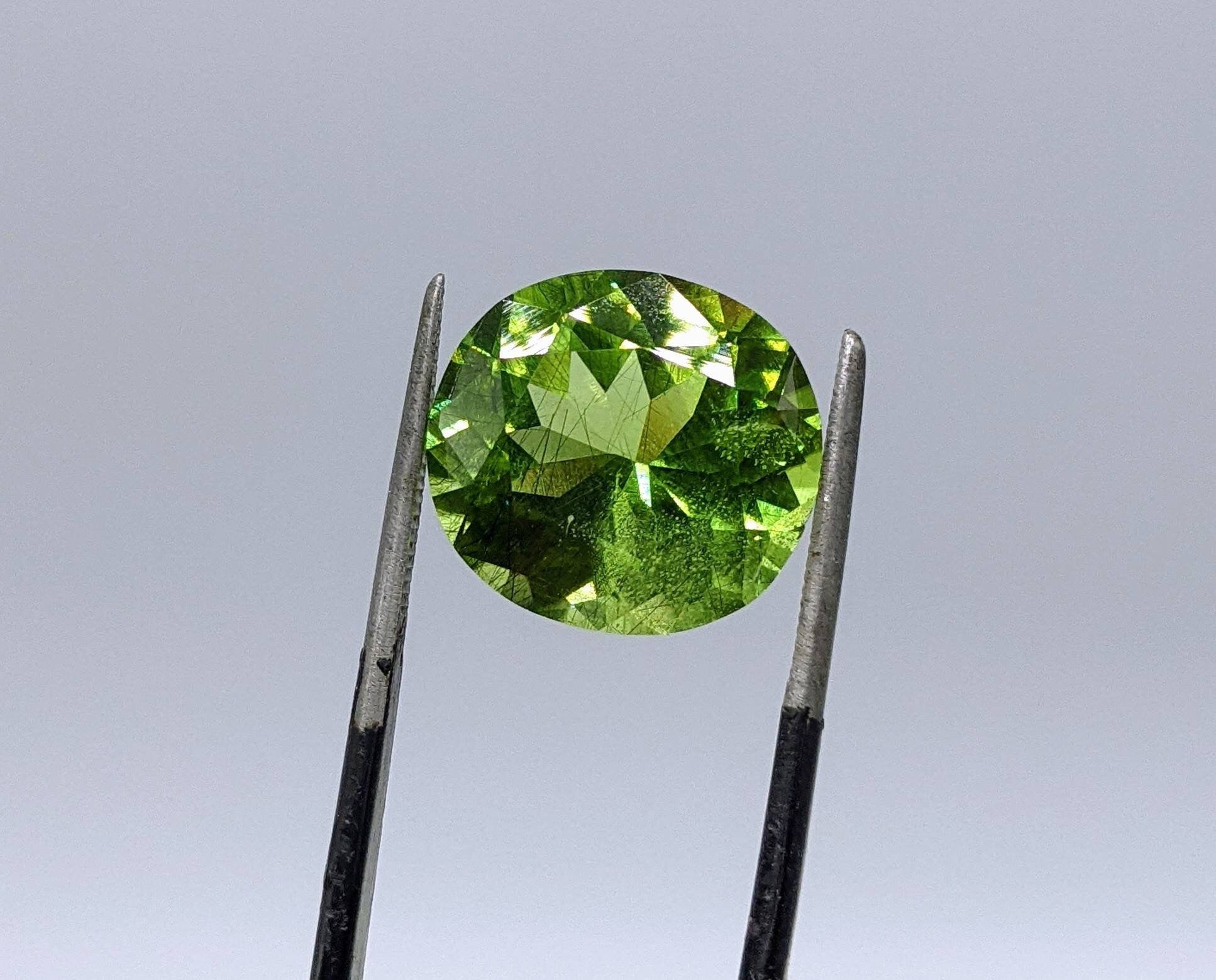 ARSAA GEMS AND MINERALSRutile peridot Gem Peridot containing hairlike inclusions Ludwigite from Mansehra KP Pakistan, 8 carats - Premium  from ARSAA GEMS AND MINERALS - Just $160.00! Shop now at ARSAA GEMS AND MINERALS