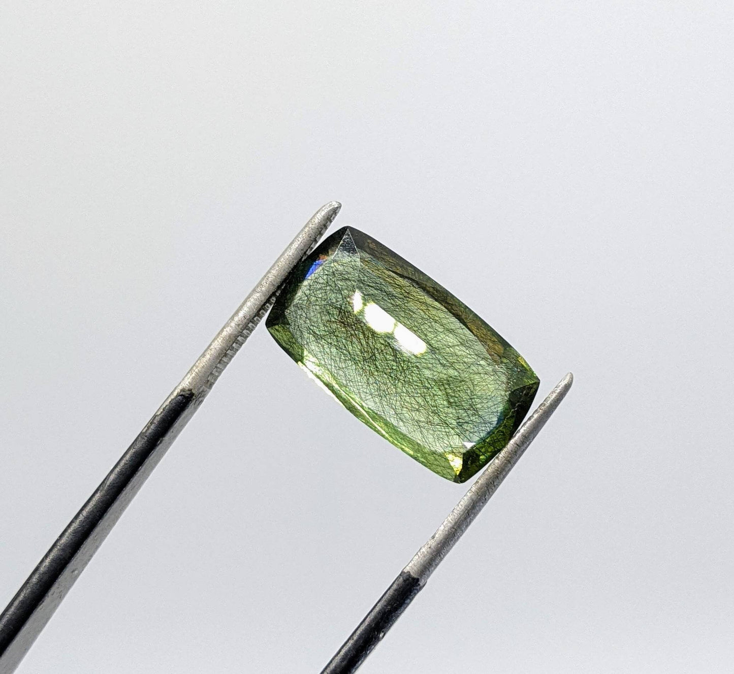 ARSAA GEMS AND MINERALSRutile peridot Gem Peridot containing hairlike inclusions Ludwigite from Mansehra KP Pakistan, 8.5 carats - Premium  from ARSAA GEMS AND MINERALS - Just $185.00! Shop now at ARSAA GEMS AND MINERALS