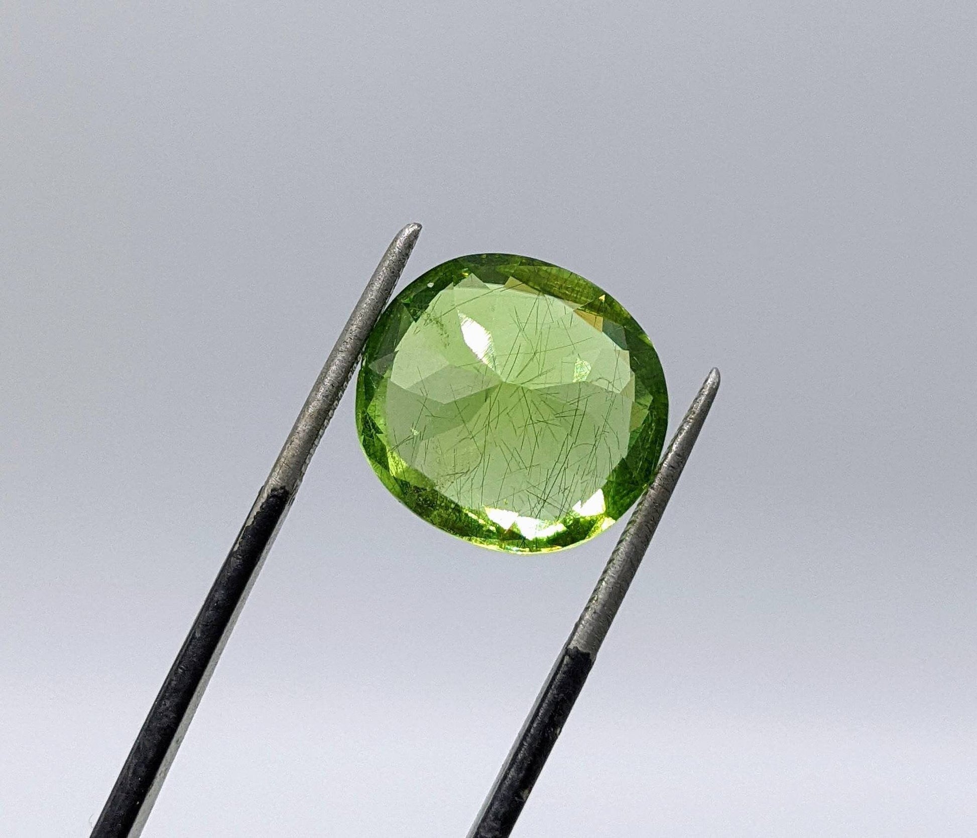 ARSAA GEMS AND MINERALSRutile peridot Gem Peridot containing hairlike inclusions Ludwigite from Mansehra KP Pakistan, 8 carats - Premium  from ARSAA GEMS AND MINERALS - Just $160.00! Shop now at ARSAA GEMS AND MINERALS