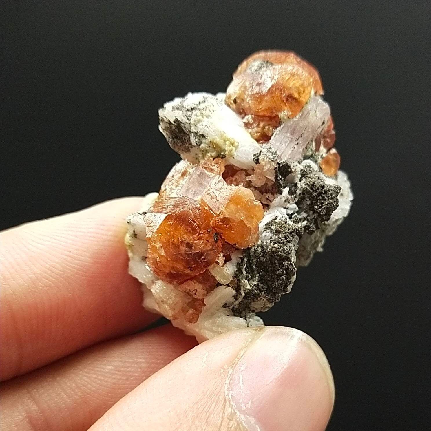 ARSAA GEMS AND MINERALSAn aesthetic Specimen of spessartine garnet on matrix with uv reactive apatite crystal from Pakistan, 13.6 grams - Premium  from ARSAA GEMS AND MINERALS - Just $100.00! Shop now at ARSAA GEMS AND MINERALS