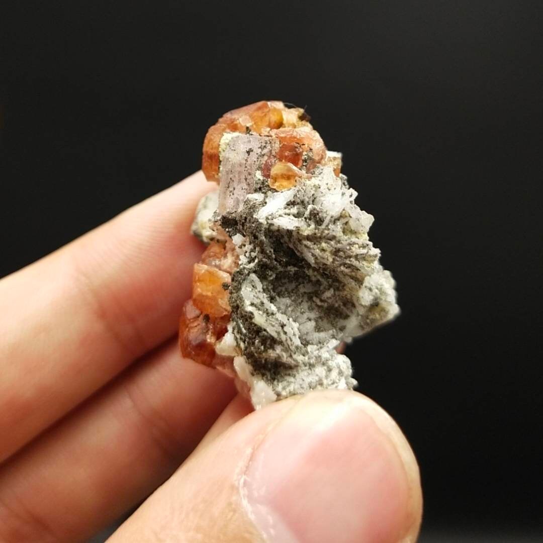 ARSAA GEMS AND MINERALSAn aesthetic Specimen of spessartine garnet on matrix with uv reactive apatite crystal from Pakistan, 13.6 grams - Premium  from ARSAA GEMS AND MINERALS - Just $100.00! Shop now at ARSAA GEMS AND MINERALS