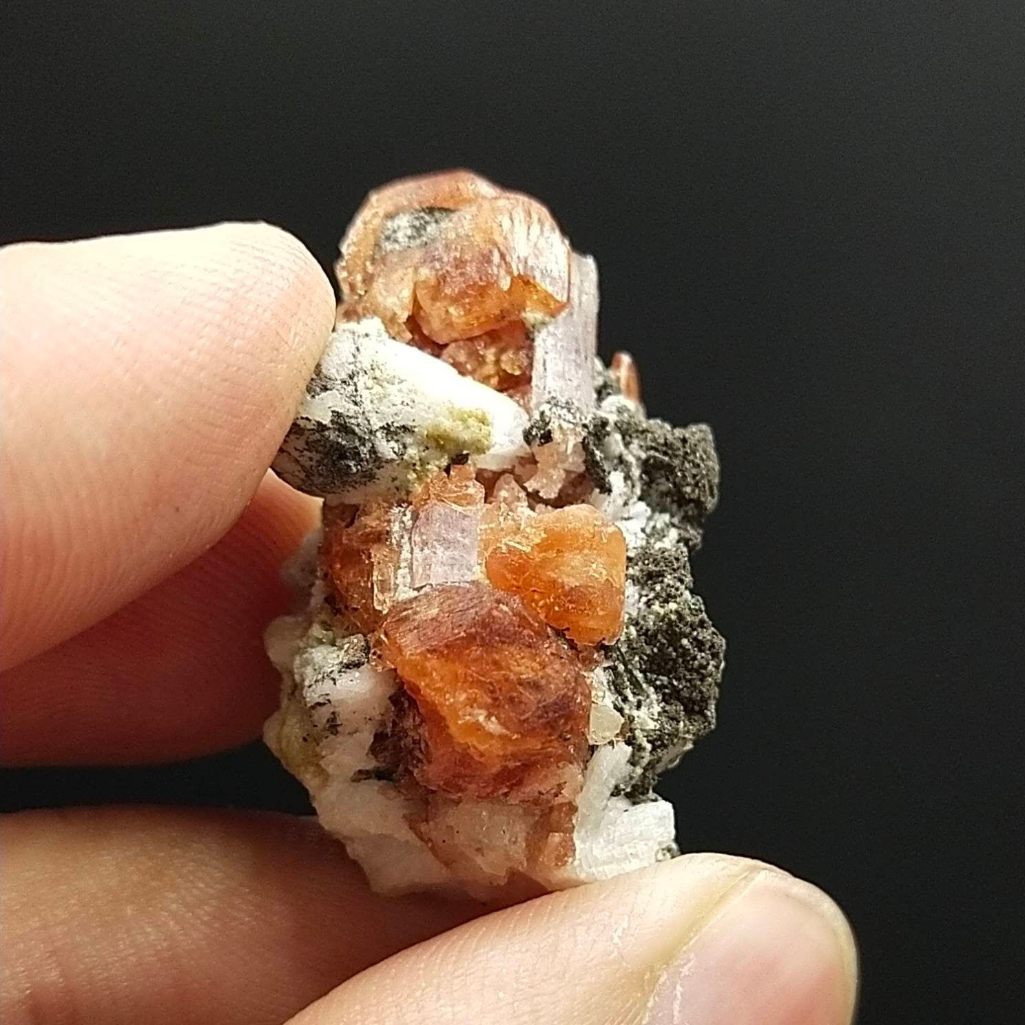 ARSAA GEMS AND MINERALSAn aesthetic Specimen of spessartine garnet on matrix with uv reactive apatite crystal from Pakistan, 13.6 grams - Premium  from ARSAA GEMS AND MINERALS - Just $100.00! Shop now at ARSAA GEMS AND MINERALS