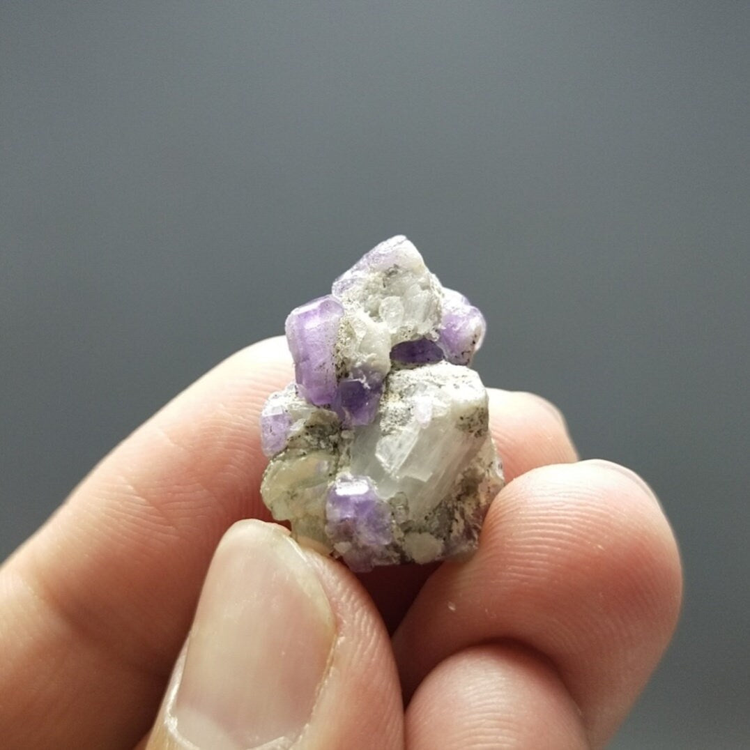 ARSAA GEMS AND MINERALSUv reactive pink apatite crystal on matrix on albite with quartz and muscovite, 4.9 grams - Premium  from ARSAA GEMS AND MINERALS - Just $25.00! Shop now at ARSAA GEMS AND MINERALS