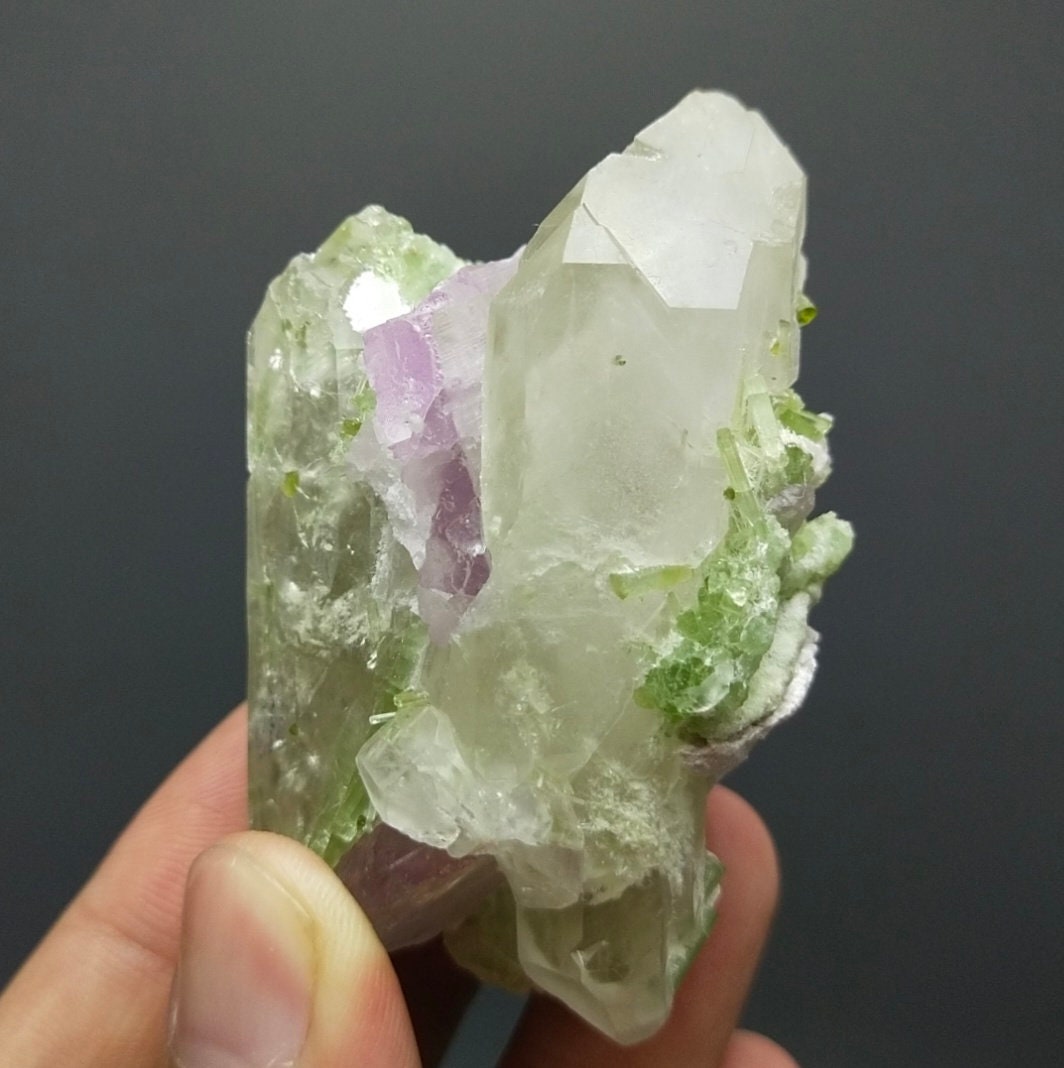 ARSAA GEMS AND MINERALSTerminated Quartz with tourmaline inclusions inside and out and two kunzite crystals are nested in its termination and it's base, 135 grams - Premium  from ARSAA GEMS AND MINERALS - Just $180.00! Shop now at ARSAA GEMS AND MINERALS