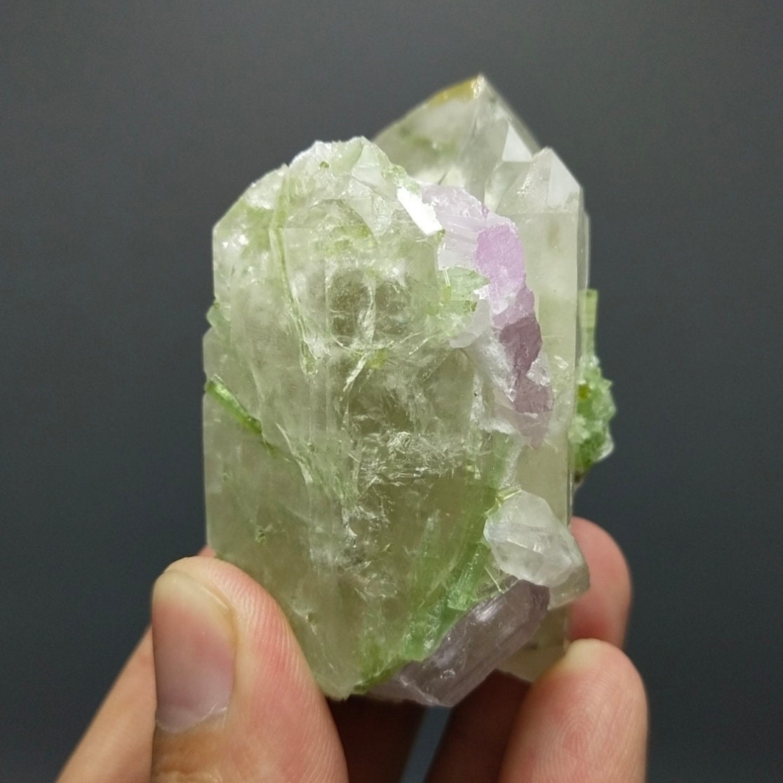 ARSAA GEMS AND MINERALSTerminated Quartz with tourmaline inclusions inside and out and two kunzite crystals are nested in its termination and it's base, 135 grams - Premium  from ARSAA GEMS AND MINERALS - Just $180.00! Shop now at ARSAA GEMS AND MINERALS